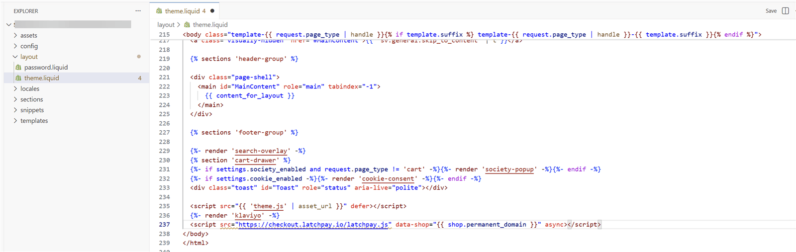 The theme code editor with layout/theme.liquid open and the LatchPay script line pasted directly above the closing body tag.